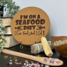 Vel Unt's Gryteunderlag - I'm on a seafood diet. I see food and I eat it. thumbnail